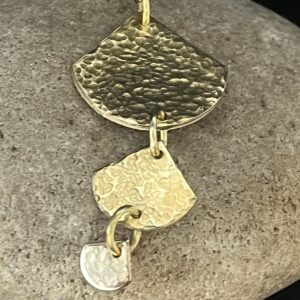 Layers of shiny brass pendant